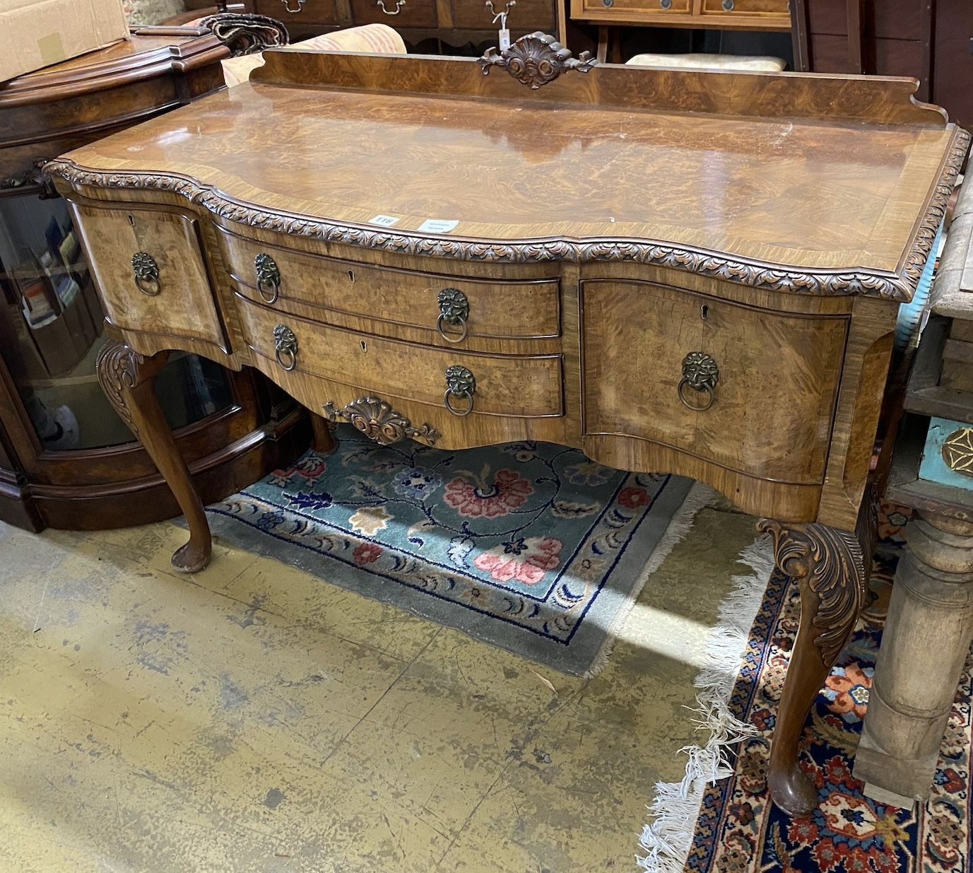 A Queen Anne walnut bowfront serving table, width 120cm depth 52cm height 90cm